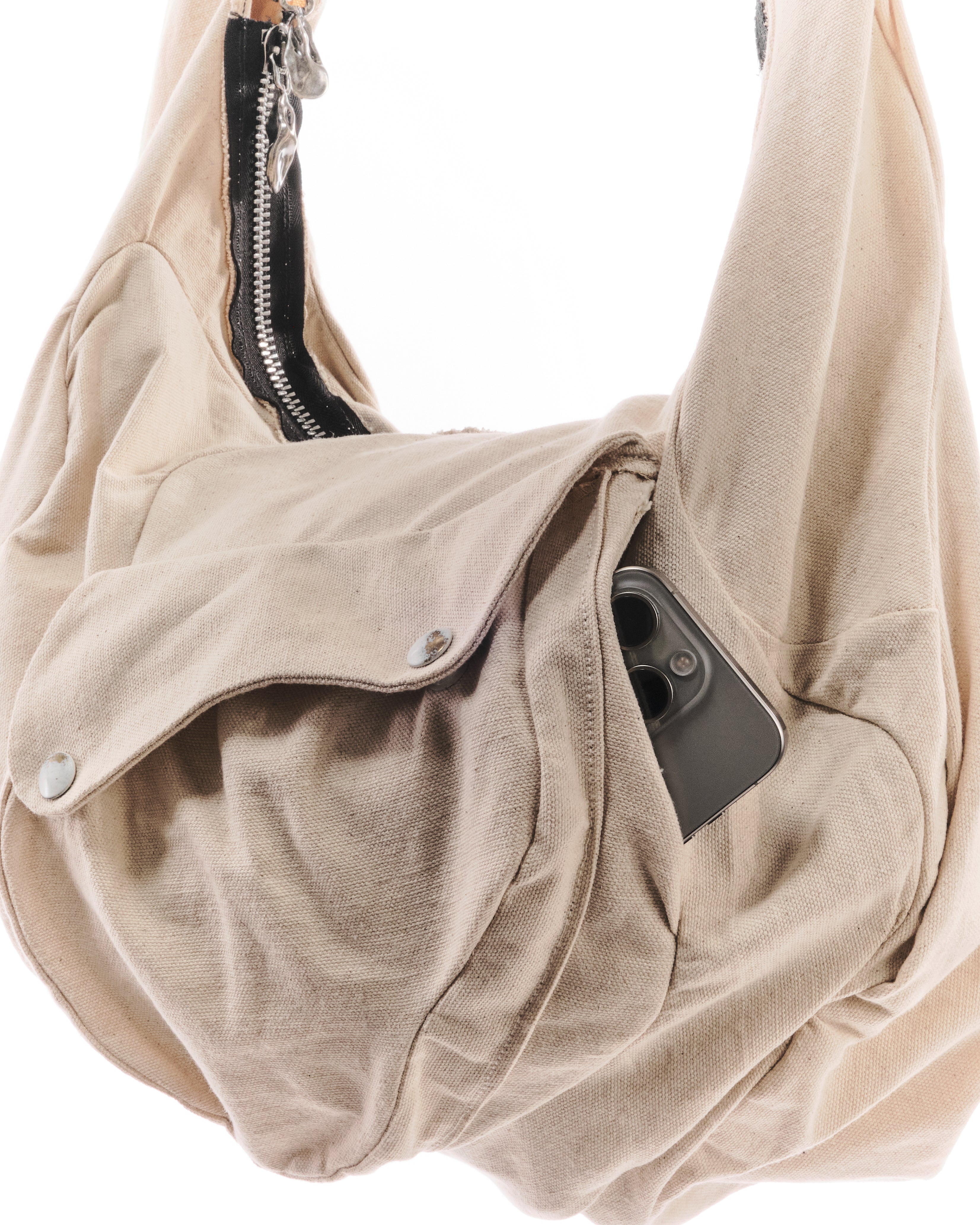 Beige handbag with a phone pocket on a white background