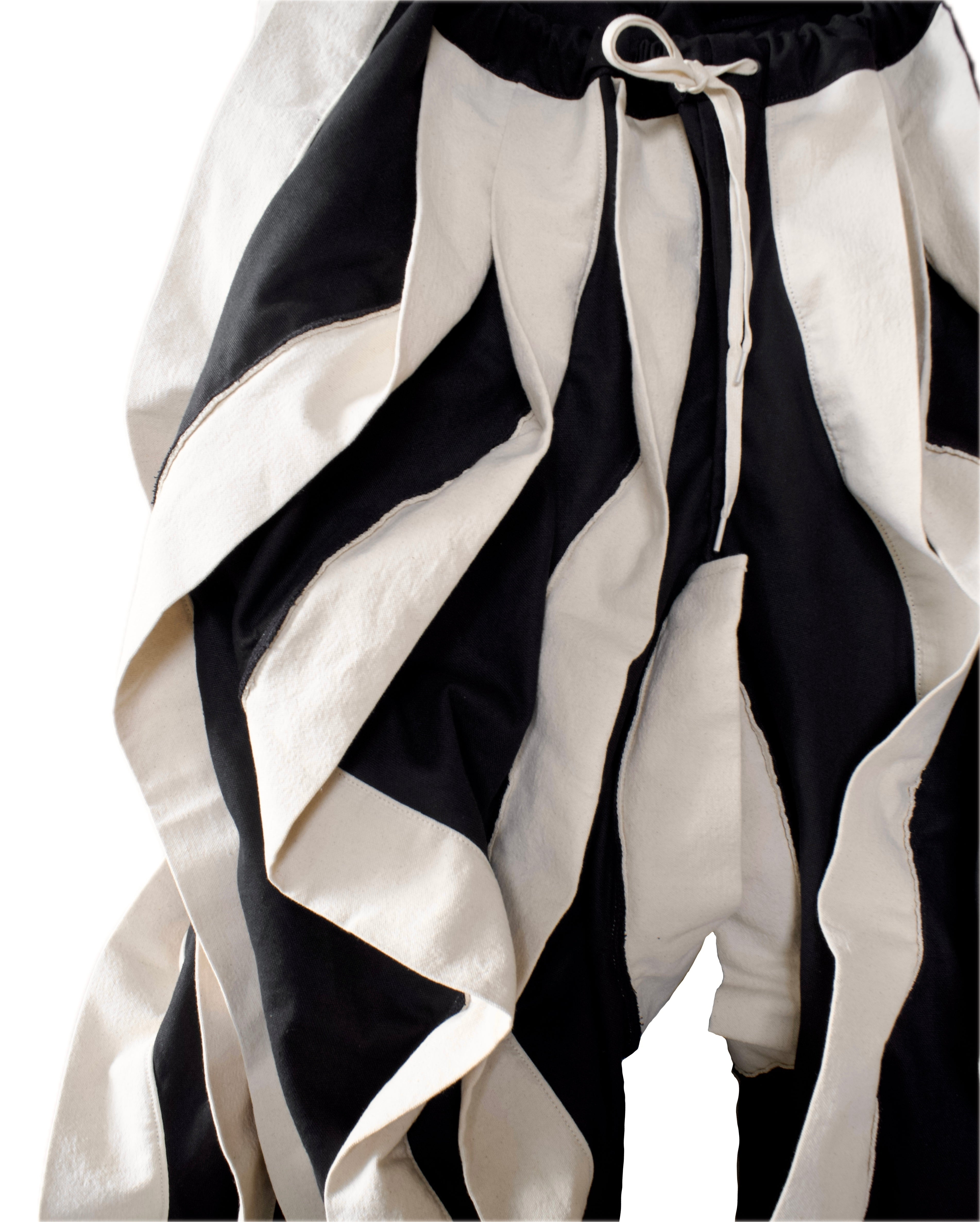 BLACK & WHITE REVERSIBLE POST HUMAN PANTS
