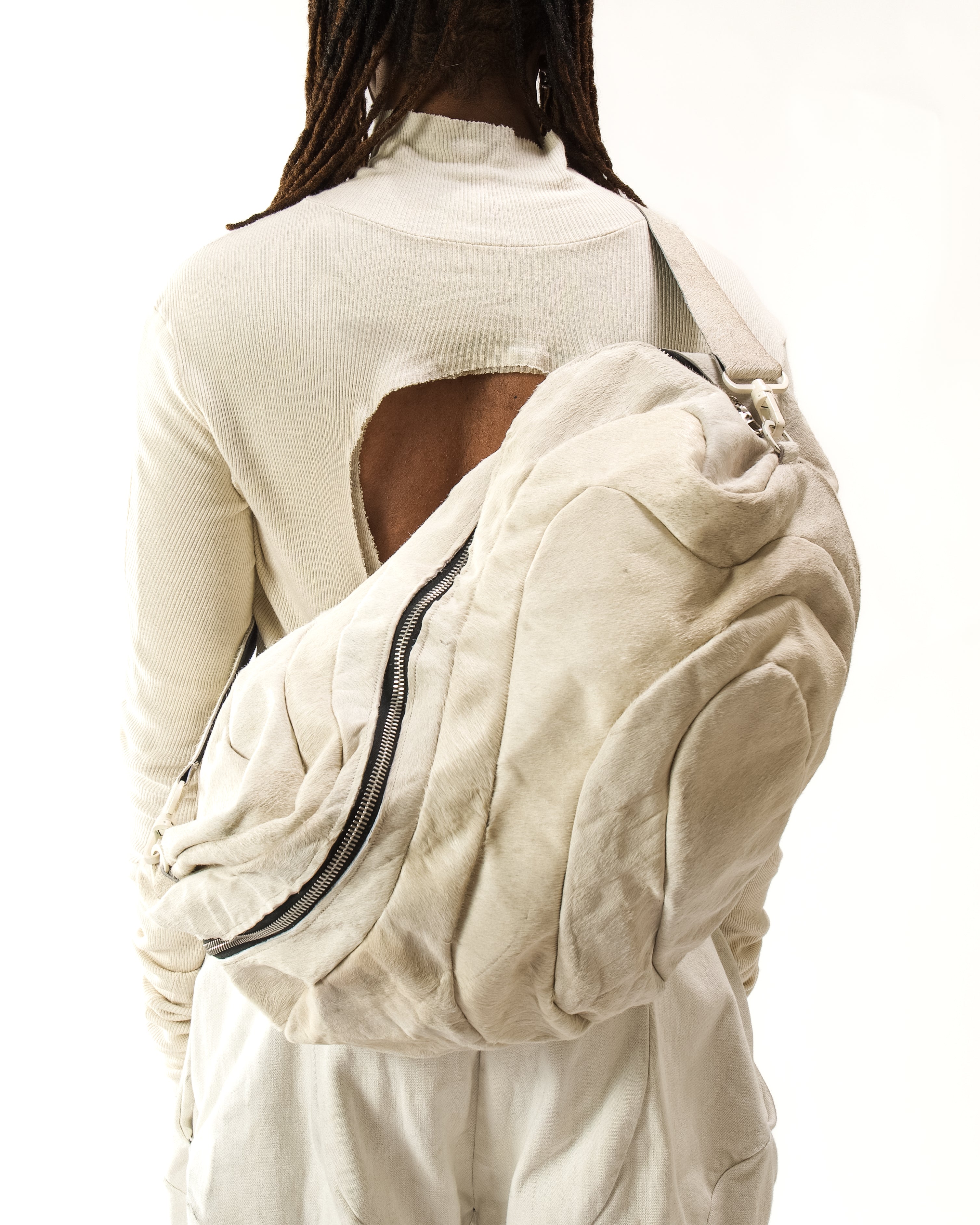 REVERSIBLE LEATHER SCULPTURAL HAIR ON HIDE BAG