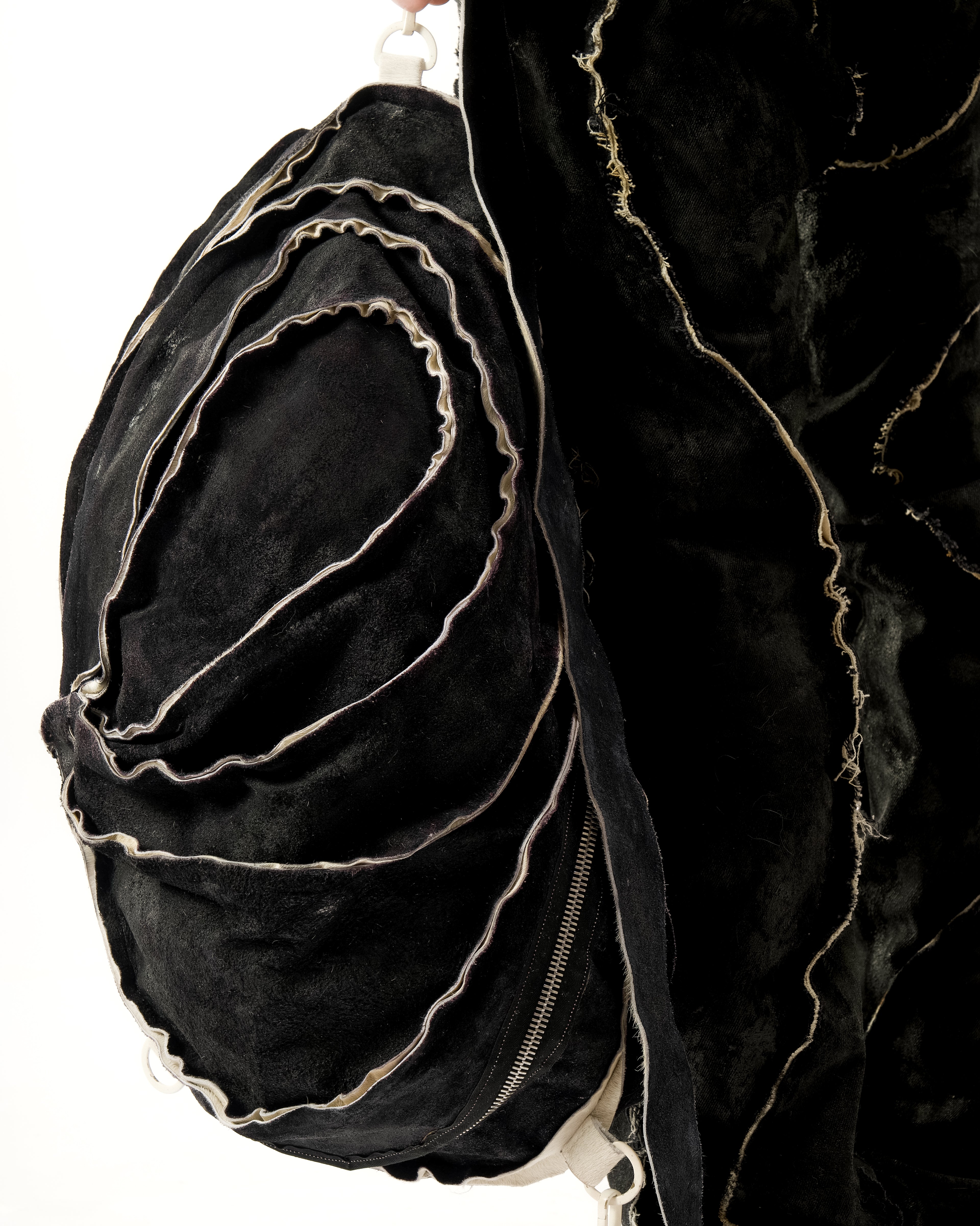 REVERSIBLE LEATHER SCULPTURAL HAIR ON HIDE BAG