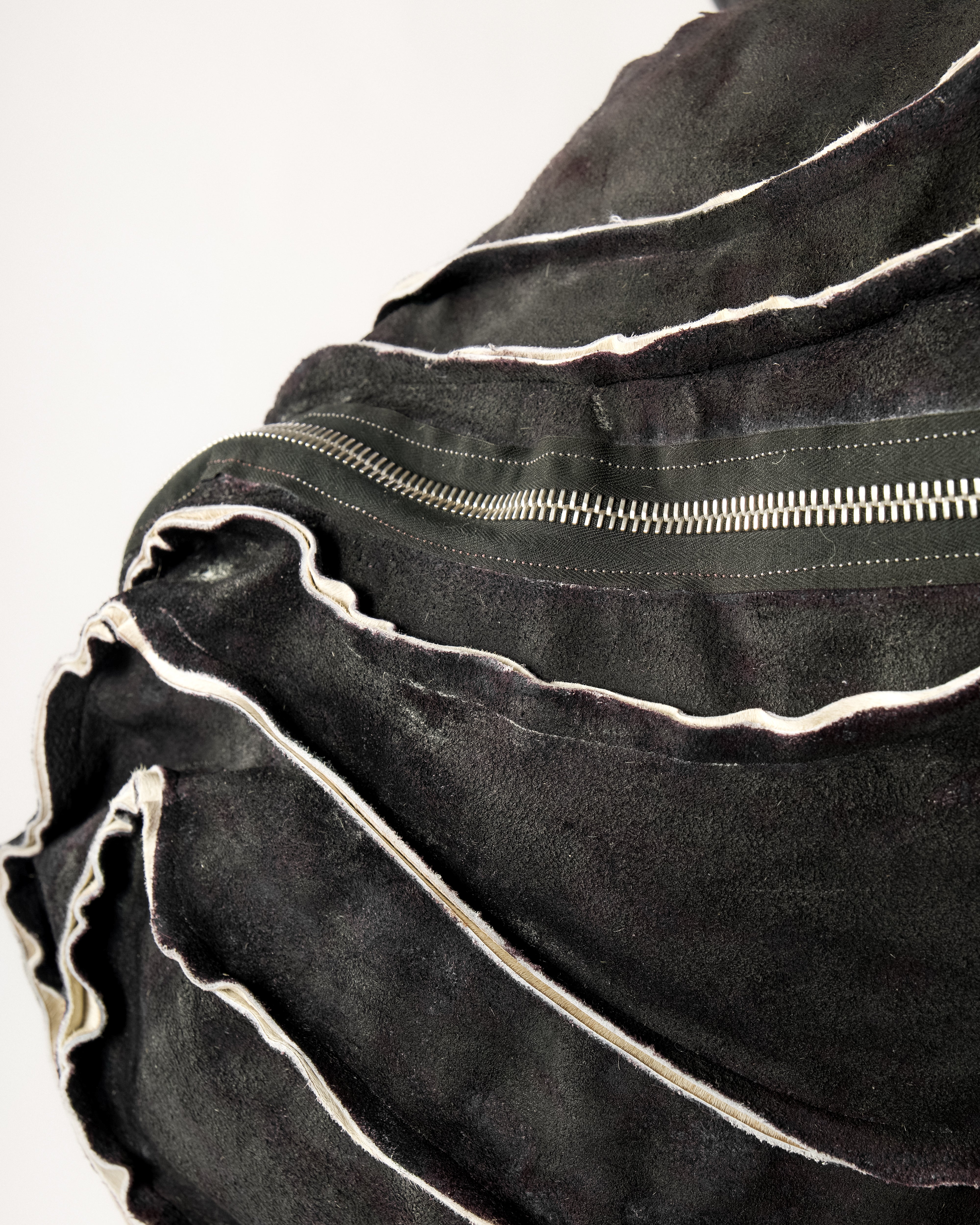 REVERSIBLE LEATHER SCULPTURAL HAIR ON HIDE BAG