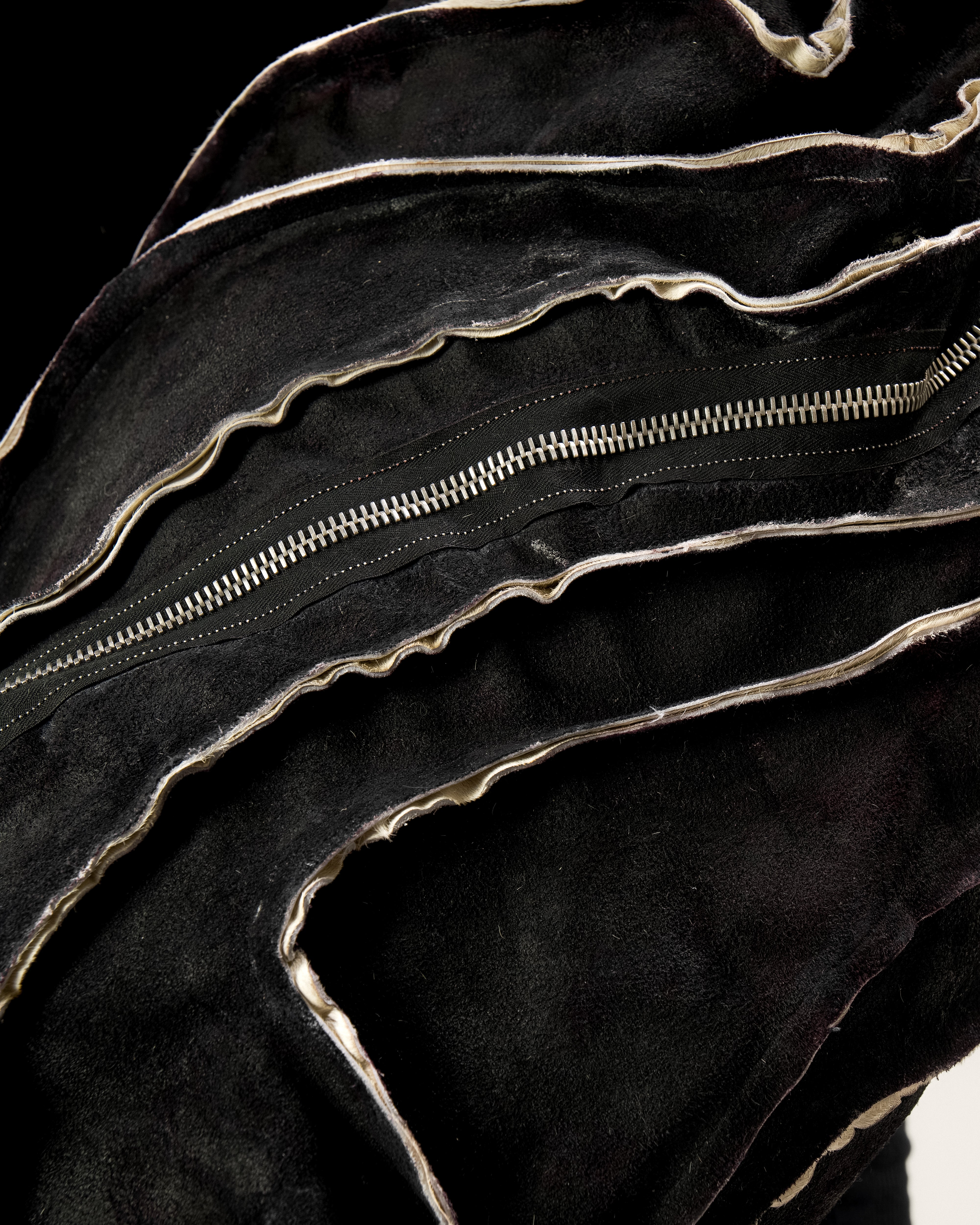 REVERSIBLE LEATHER SCULPTURAL HAIR ON HIDE BAG