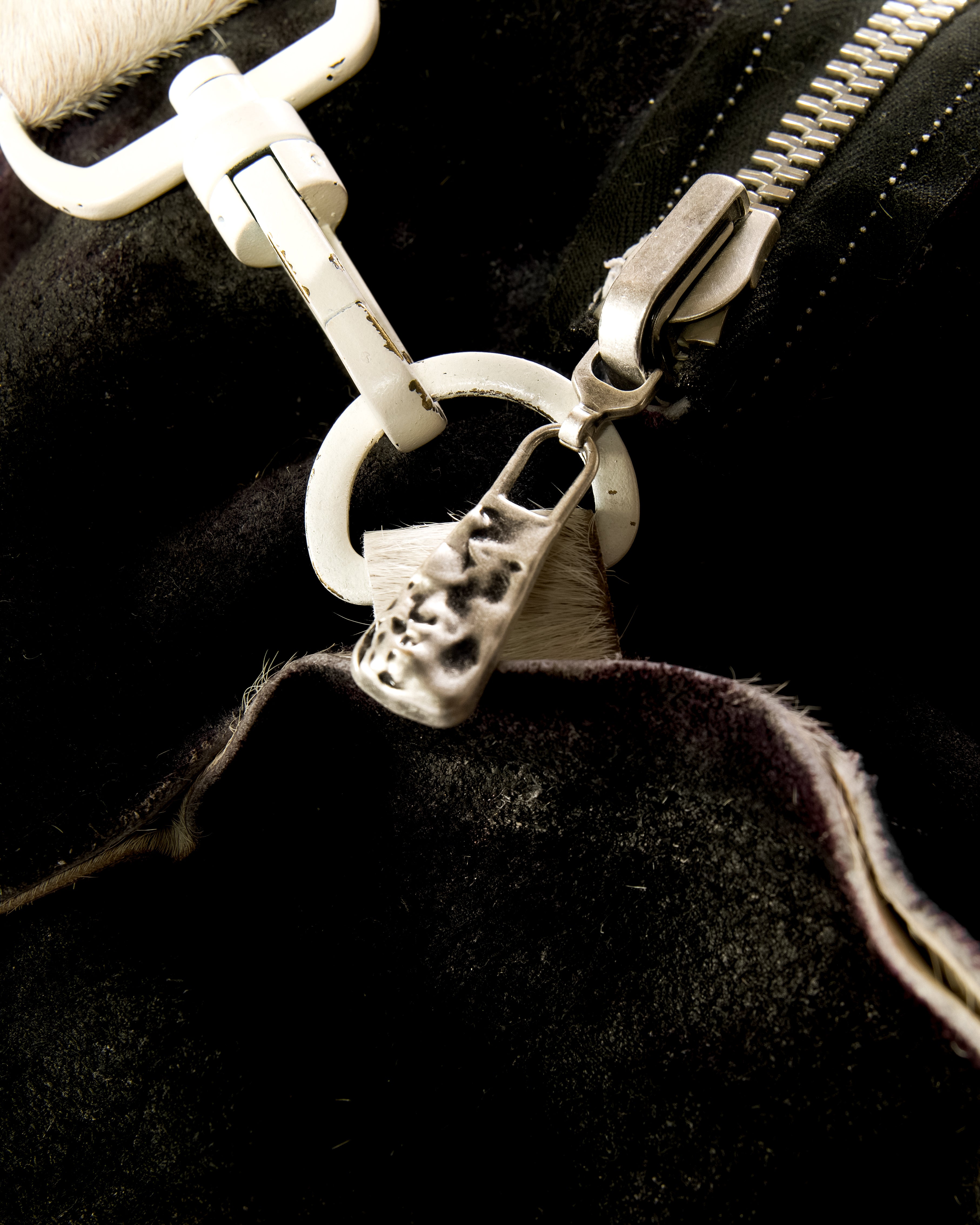 REVERSIBLE LEATHER SCULPTURAL HAIR ON HIDE BAG