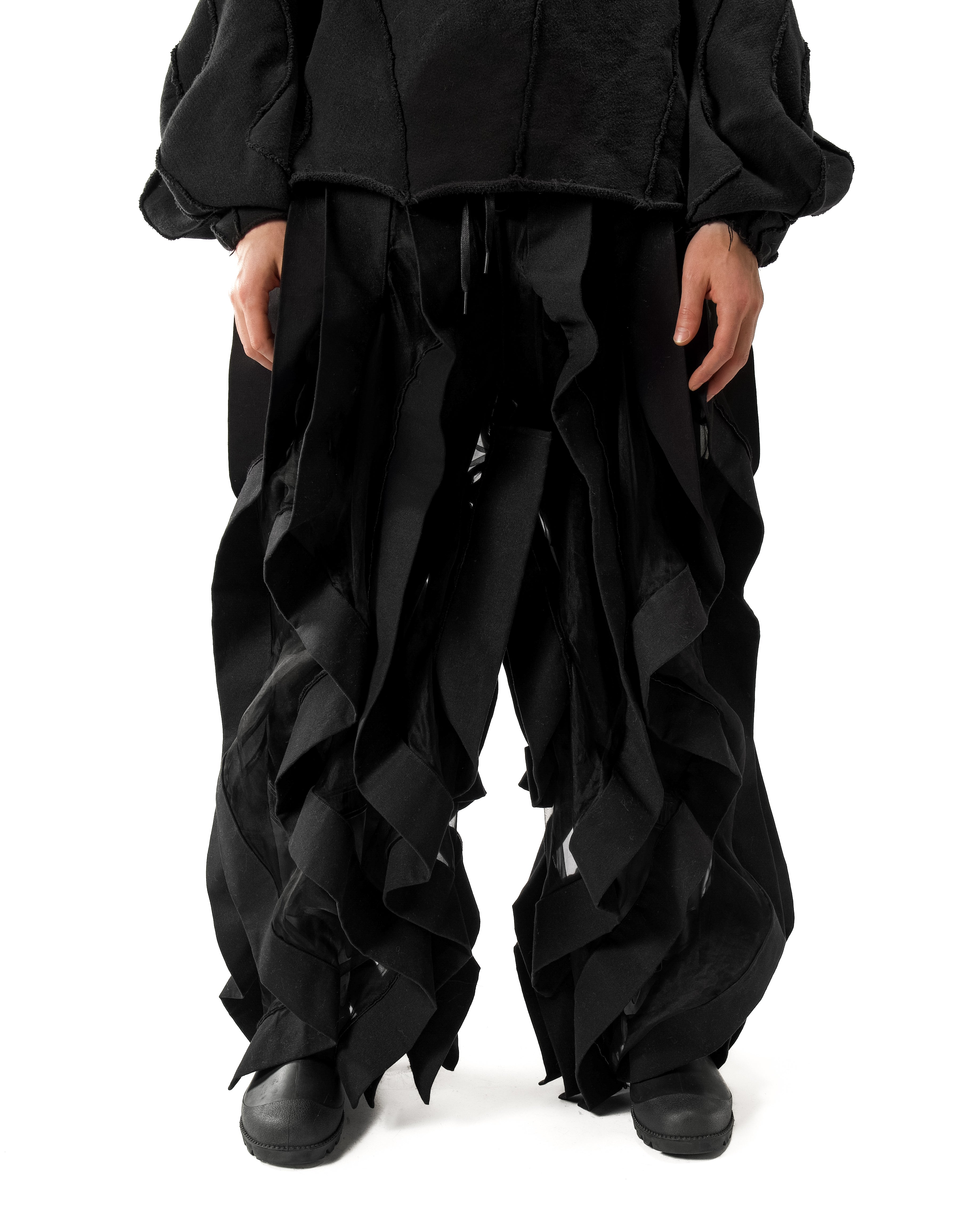 BLACK REVERSIBLE SHEER POST HUMAN PANTS